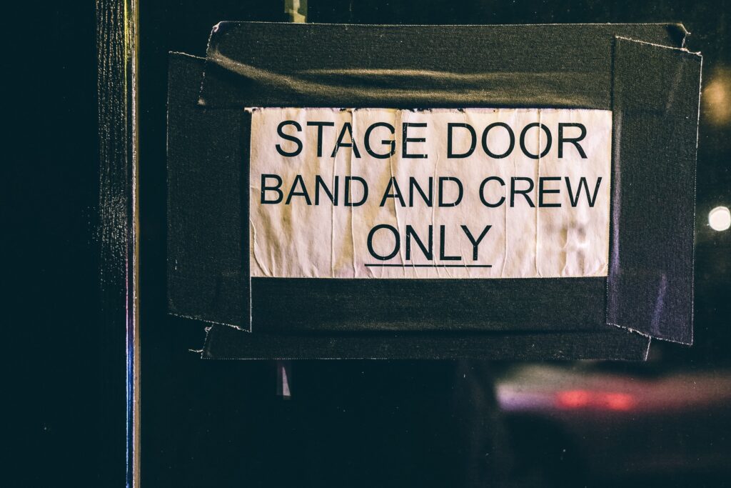 a backstage pass sign into an event